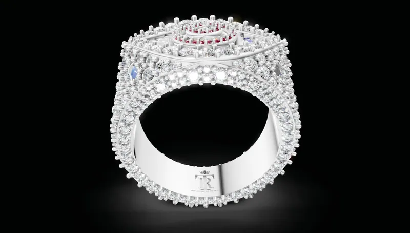 Computer rendering of an ornate stone-set ring, side view