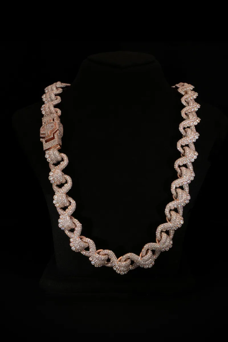 Custom stone-set link chain on a black bust