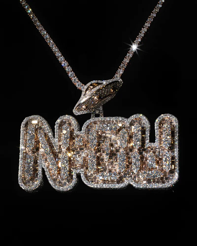 Custom stone-set lettering pendant with an orbit motif